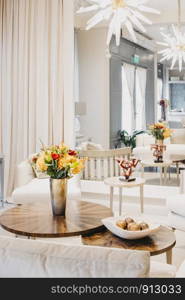 Floral arrangement of roses and carnations decorating the living room of the house