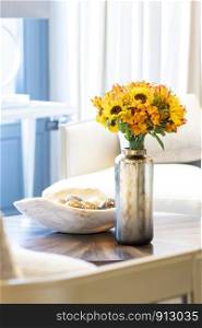 Floral arrangement of sunflowers decorating the living room of the house