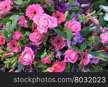 Floral arrangement with pink and purple flowers after a rainshower