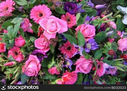 Floral arrangement with pink and purple flowers after a rainshower