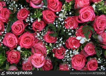 Floral arrangement with pink roses and gypsophila or baby&rsquo;s breath