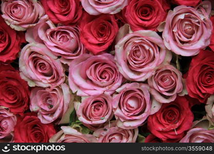 Floral arrangement with roses in two shades of pink