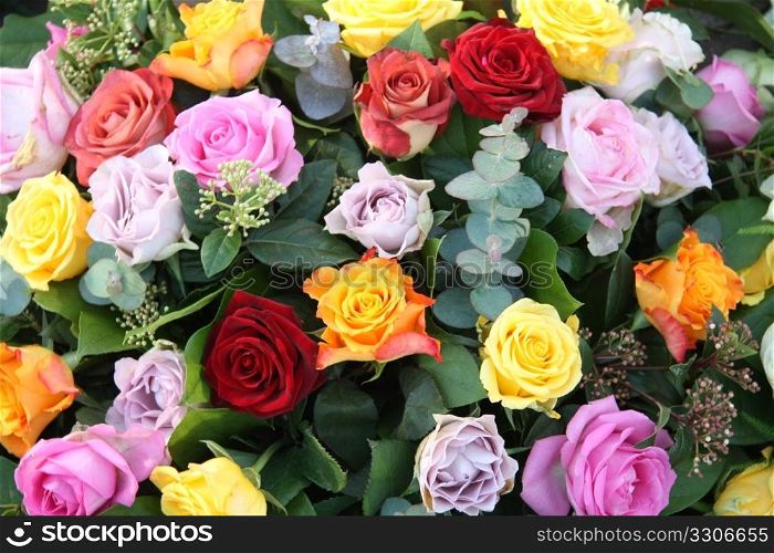 Floral arrangement with roses in various colors