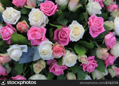 floral arrangement with roses in white and pink