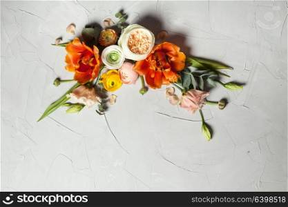 Floral design card. Creative orange and beige flowers flat lay border for holiday greetings