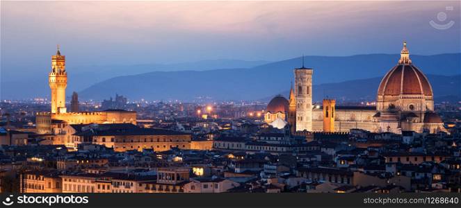 Florence Cathedral (Cattedrale di Santa Maria del Fiore) in historic center of Florence, Italy with night panoramic view of the city. Florence Cathedral is major tourist attraction of Tuscany, Italy.