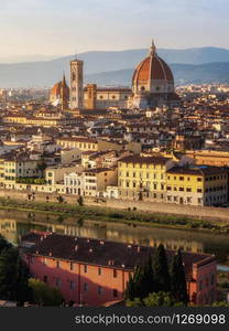 Florence Cathedral (Cattedrale di Santa Maria del Fiore) in historic center of Florence, Italy with panoramic view of the city. Florence Cathedral is the major tourist attraction of Tuscany, Italy.