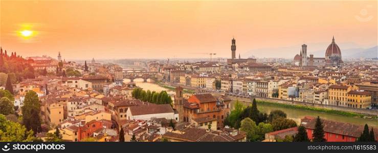 Florence city during sunset. Panoramic view to the river Arno, with Ponte Vecchio, Palazzo Vecchio and Cathedral of Santa Maria del Fiore  Duomo , Florence, Italy