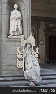 Florence, Italy ? September 2014 Living statue street busker stays immobile in front of a real marble statue. September 2, 2014 in Florence, Italy.