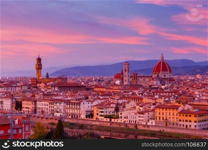 Florence. Palazzo Vecchio.. View of the Palazzo Vecchio and Duomo illuminated at sunset. Italy.