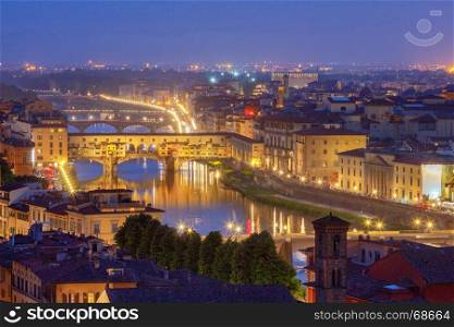 Florence. Ponte Vecchio.. The old medieval bridge Ponte Vecchio in Florence at sunset. Italy.