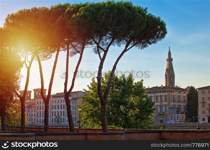 Florence riverfront landmarks sun haze view, Tuscany region of Italy