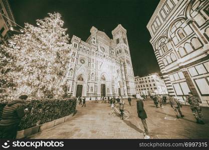 FLORENCE, TUSCANY - DECEMBER 16, 2018: Duomo of Florence at night with Christmas tree.