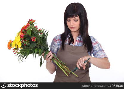 Florist cutting stems off flowers