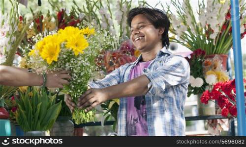 Florist giving a bouquet to a customer