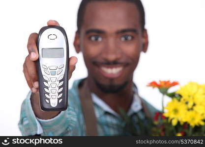 Florist holding telephone