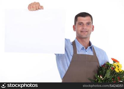 Florist holding up a blank sign