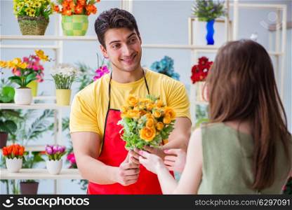 Florist selling flowers in a flower shop