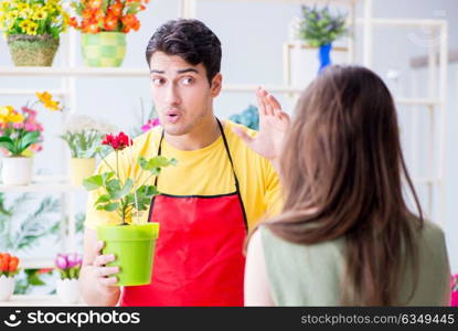 Florist selling flowers in a flower shop