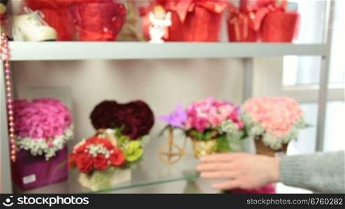 Florist Serving Customer in Flower Shop, Man Buying Rose Basket Arrangement, Closeup, Focus On The Bouquet