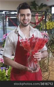 Florist stands with dried red flowers