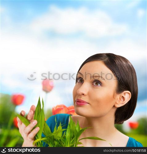 Florist woman working with flowers and plants at garden