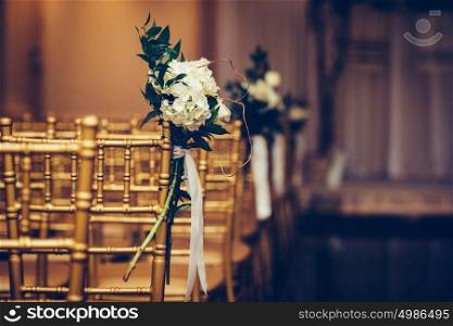 Floristic design on wedding ceremony day. Buch of flowers in wedding hall.