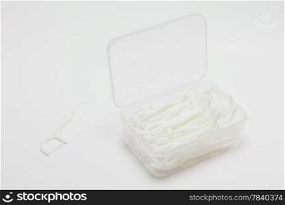 Flosser toothpick on white background