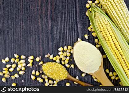 Flour and grits corn in spoons, cobs and grains maize on a background of wooden boards