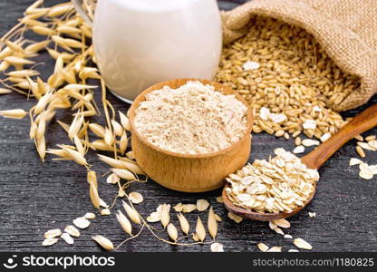Flour oat in a bowl, grain in a bag, oatmeal in a spoon, oaten stalks on wooden board background