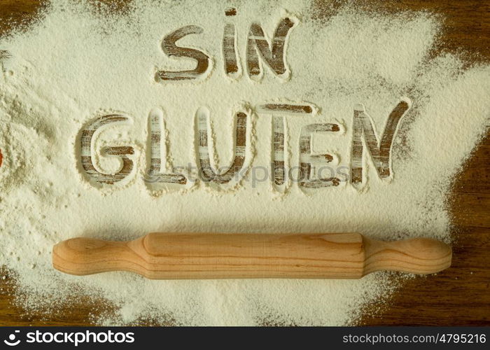 Flour on the table with writted word SIN GLUTEN