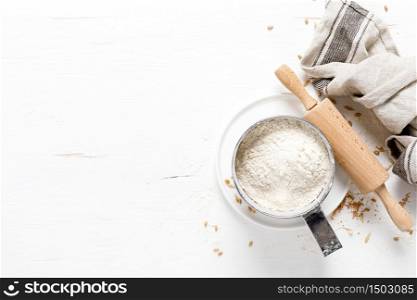 Flour on white kitchen worktop, baking culinary background, copy space, overhead view