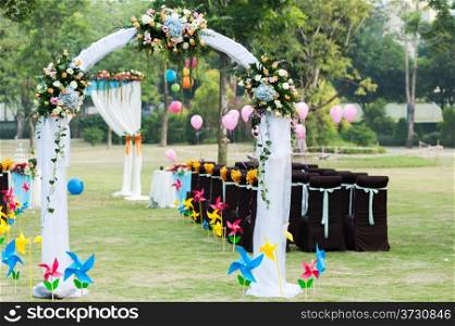 Flower arch for wedding on the lawn