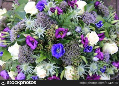 Flower arrangement in white, purple and blue