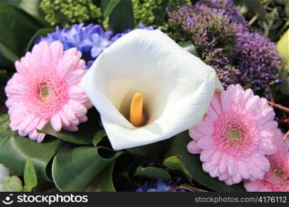 Flower arrangement with a big arum lily and pink gerberas