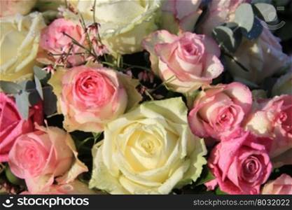 Flower arrangement with soft pink and white roses