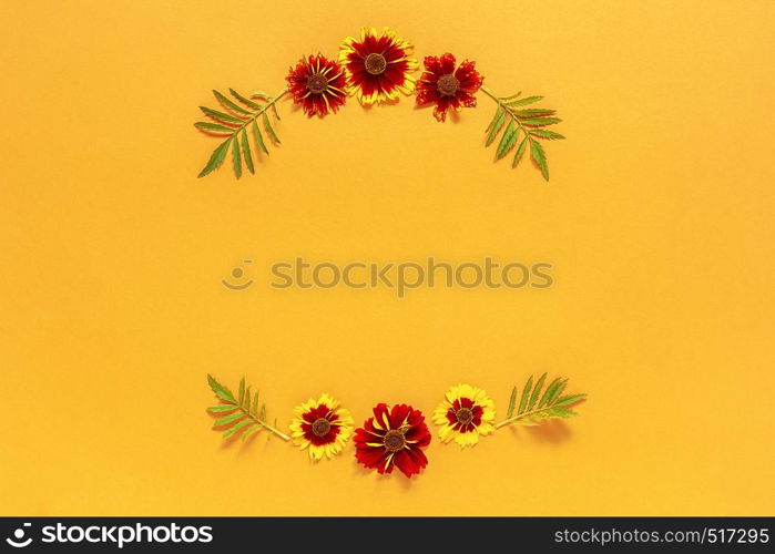 Flower composition. Frame floral round wreath of yellow red flowers on orange background. Flat lay Top-down composition. Copy space Mock up Template for postcard, lettering text or your design.. Flower composition. Frame floral round wreath of yellow red flowers on orange background. Flat lay Top-down composition. Copy space Mock up Template for postcard, lettering text or your design