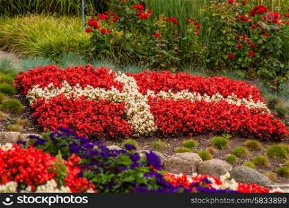 Flower garden with red and white flowers illustrating the danish flag