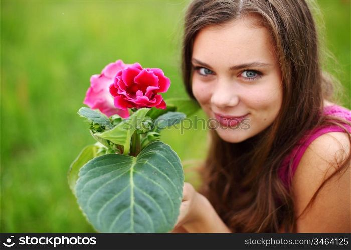 flower in woman hands close up