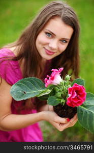 flower in woman hands close up