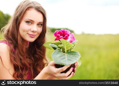 flower in woman hands close up