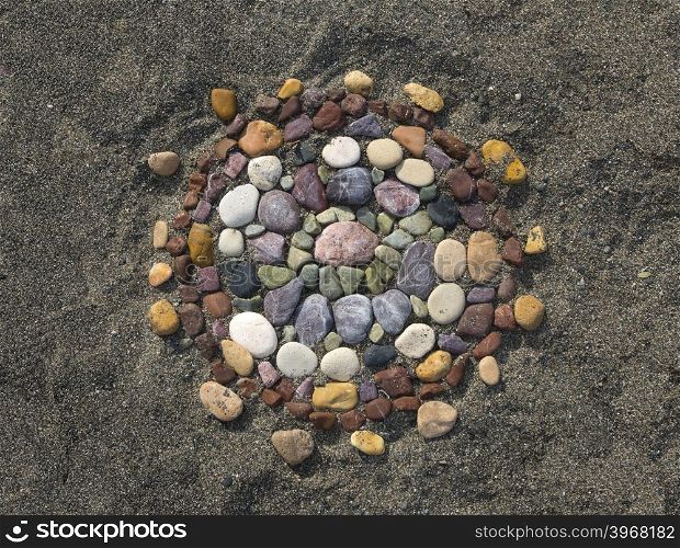 flower made with stones on the beach