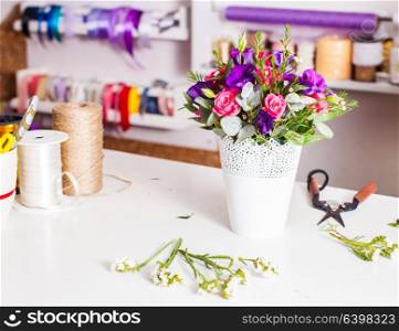 Flower market place. Different decoration for bouquets is on the table floristic store, ikebana. Decoration for bouquets