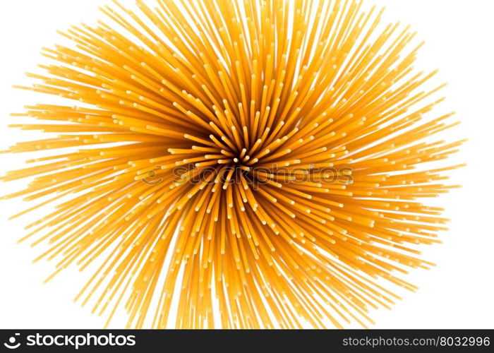 Flower of whole wheat spaghetti gathered in a bunch, view from top on white