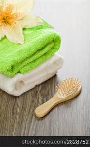 flower on cotton towels with hairbrush