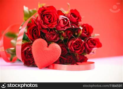 Flower roses bouquet on red background / Red heart with ribbon and rose romantic love valentine day concept