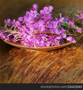 Flower Willowherb - Epilobium Angustifolium on wooden background .. Flower Willowherb - Epilobium Angustifolium on wooden background
