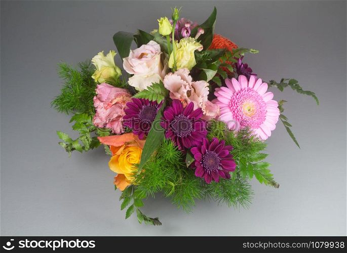 Flowers arrangement with roses and gerberas