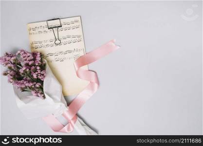 flowers bouquet with music sheet light table