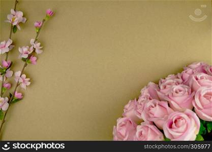 Flowers composition. Frame made of dried pink flowers on paper background